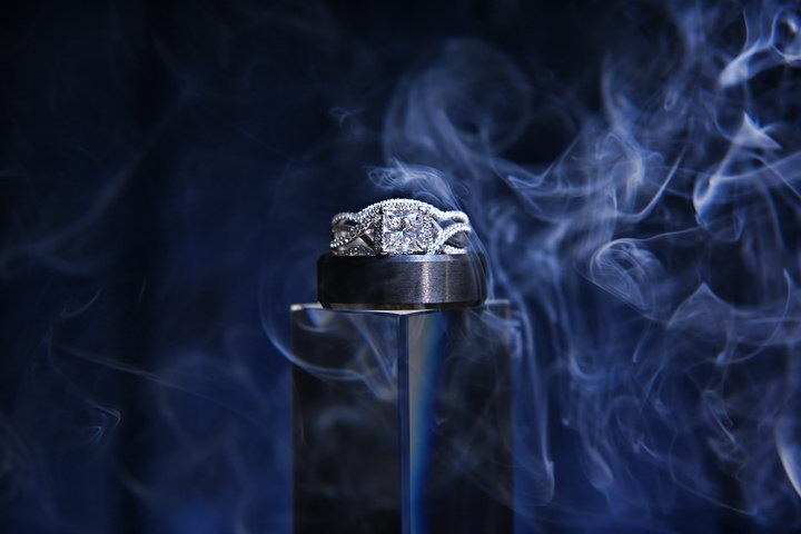 Wedding rings in blue smoke