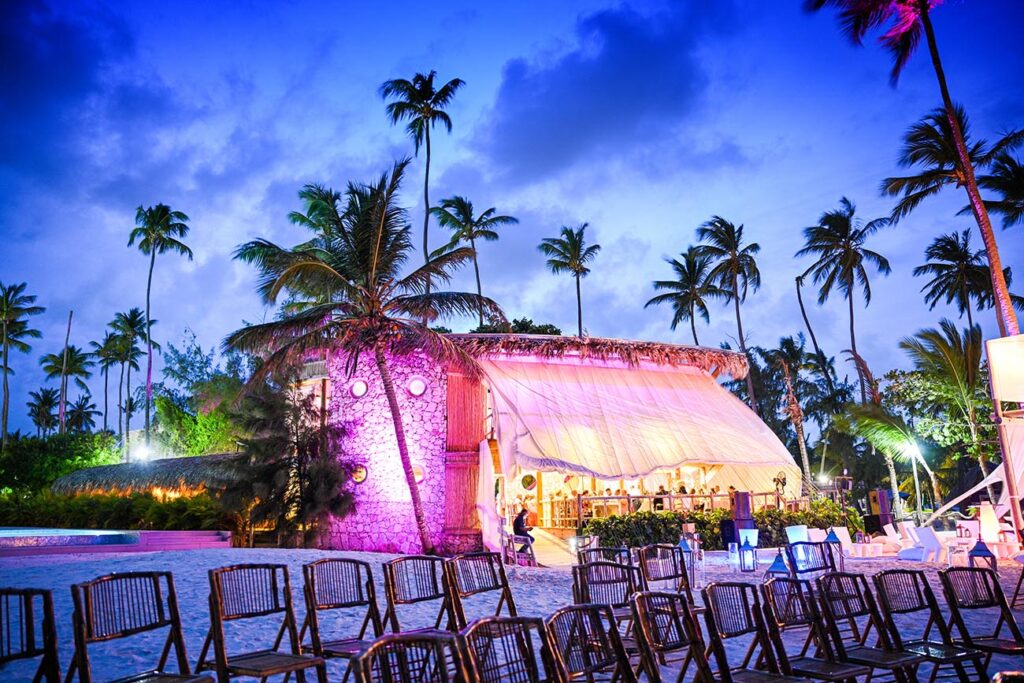 Wedding celebration in beach restaurant with purple light