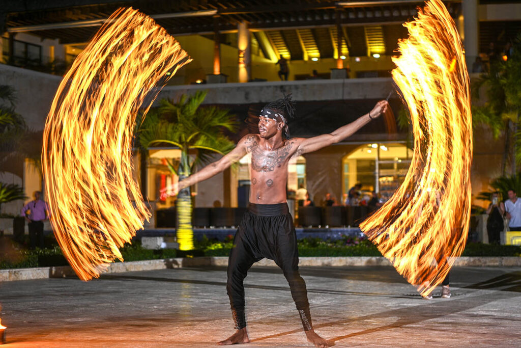 Man performing dance with fire
