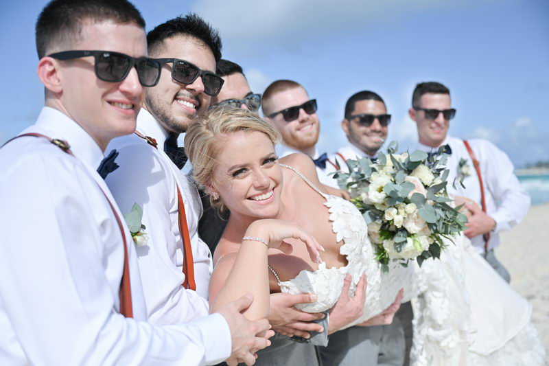 groomsmen holding bride at hard rock