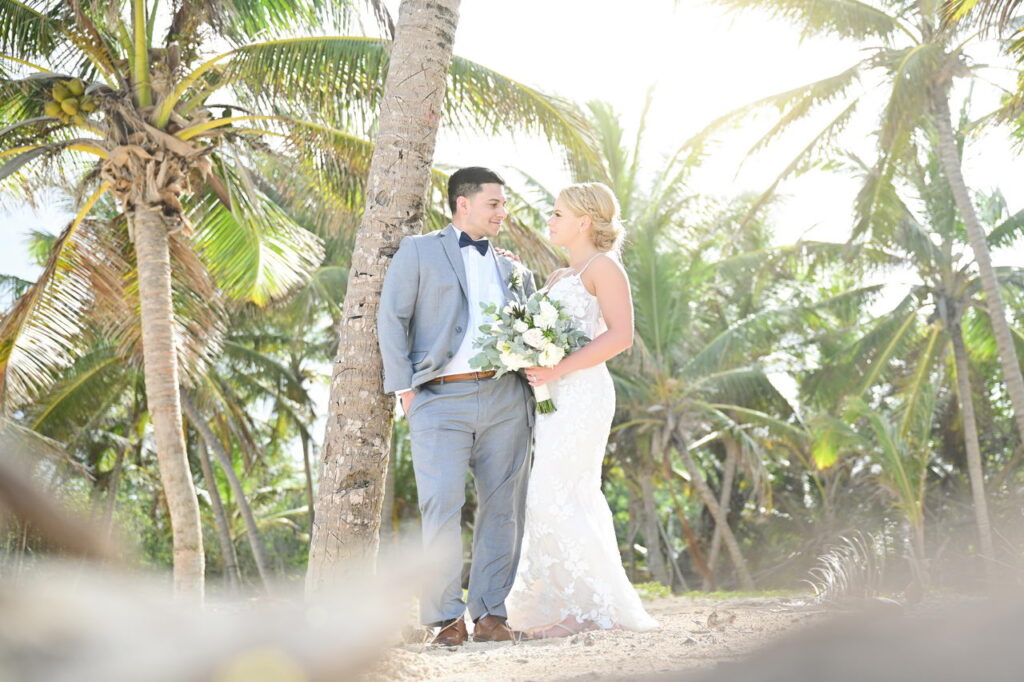 Couple at palm tree forest HR Punta Cana wedding photographer