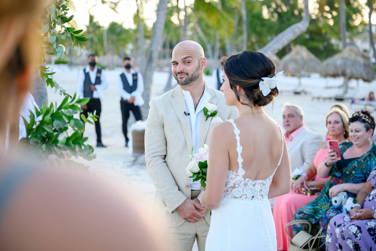 groom and bride at beach ceremony by Photo Cine Art