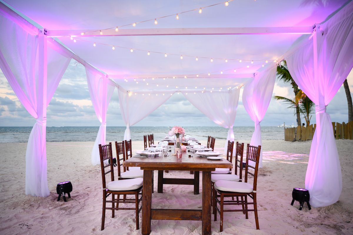 purple wedding reception tent at dreams hotel