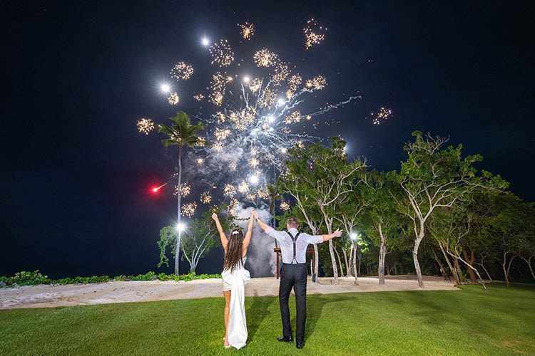 Fireworks and a wedding couple at night