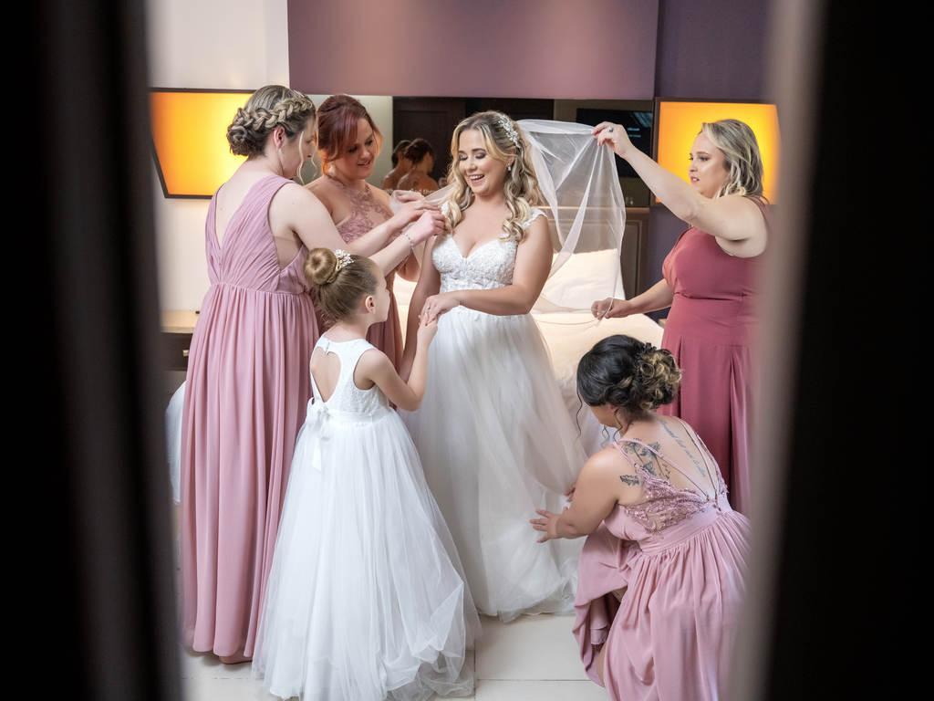 Bride with bridesmaids by photo cine art