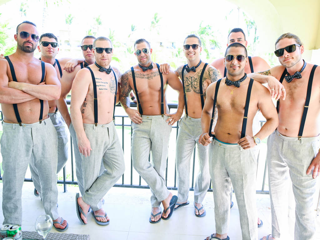 Groomsmen with suspenders and bowtie by Photo Cine Art