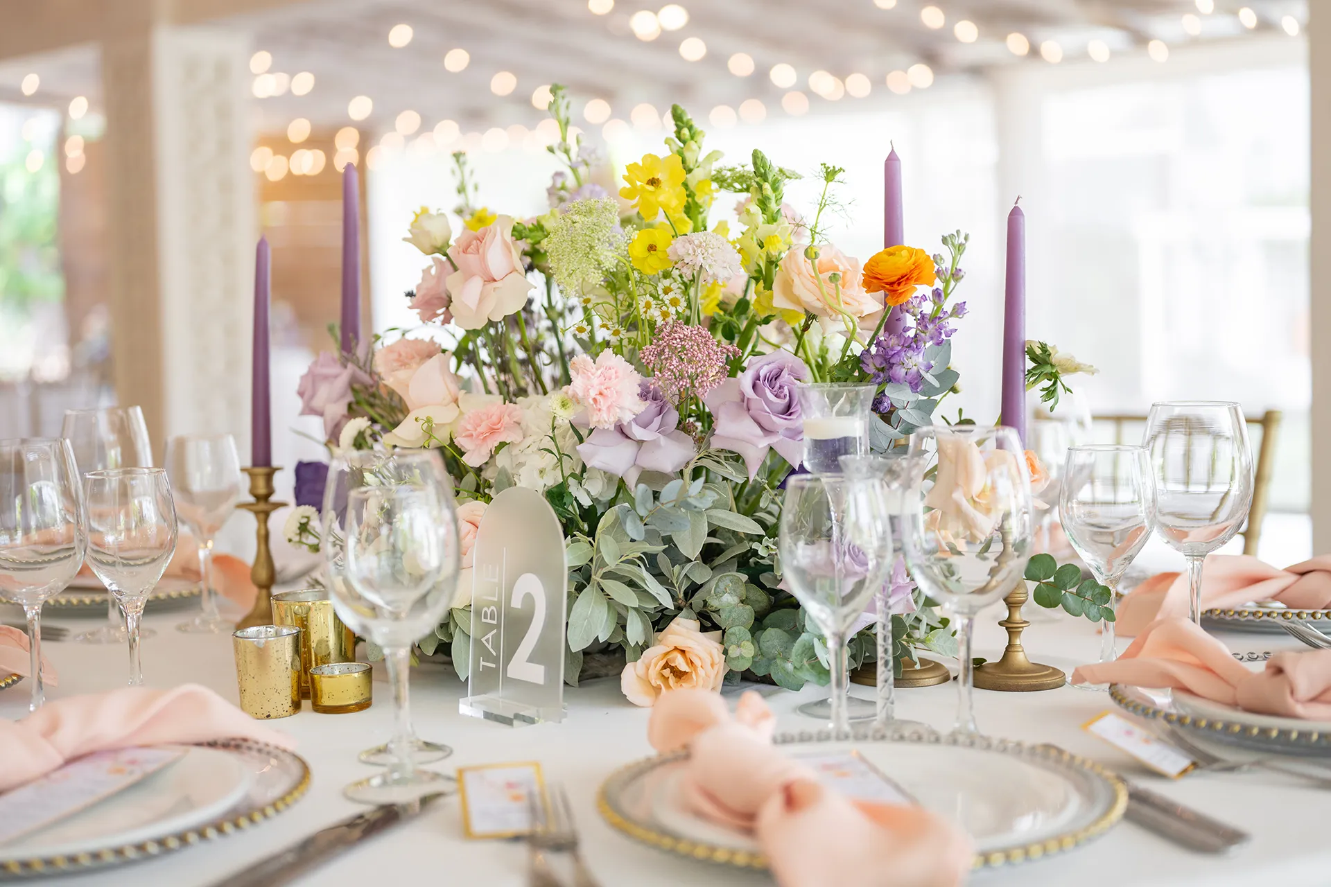 Garden-inspired floral reception design inside Kukua Beach Club restaurant