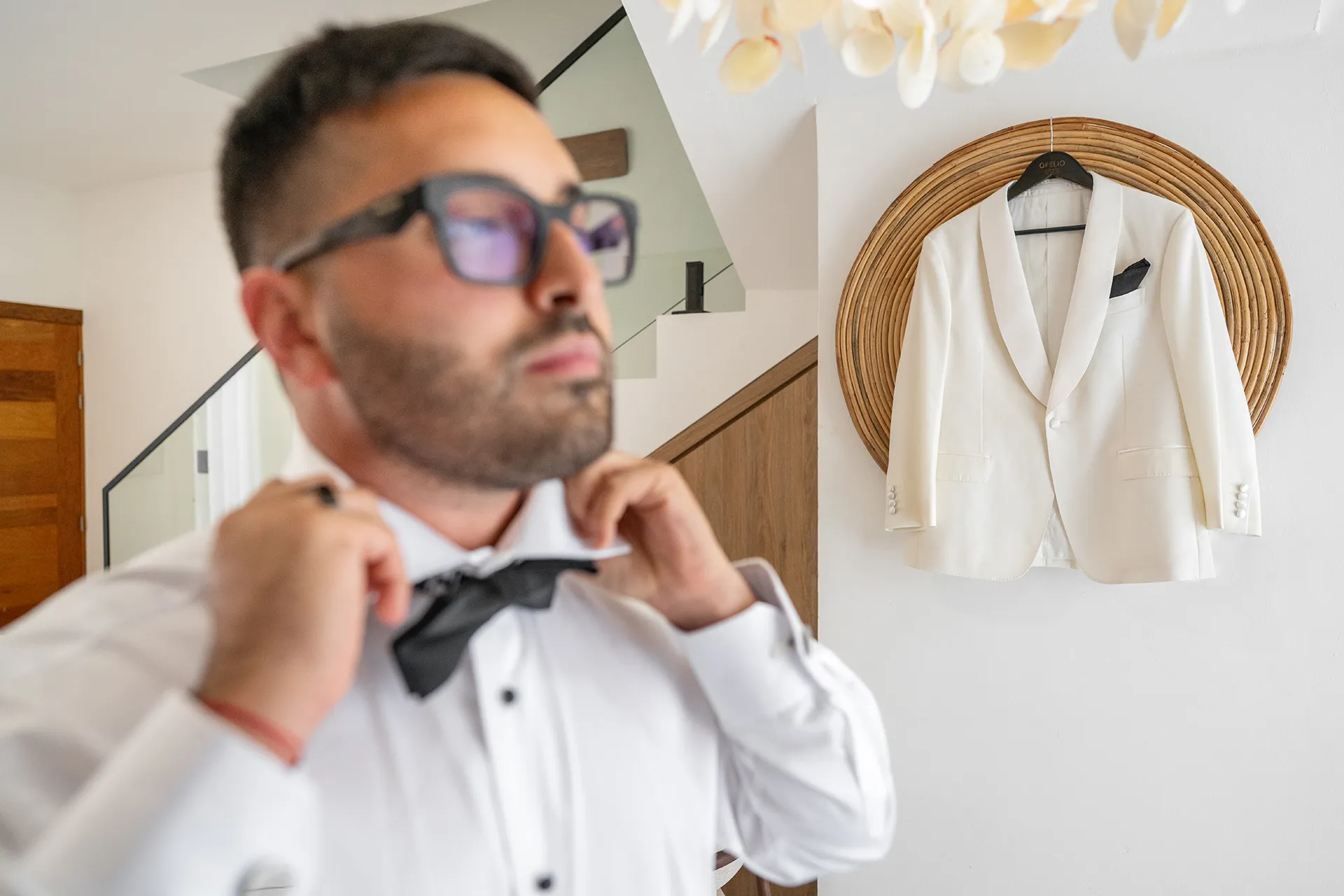 Groom adjusting his bowtie before Pearl Beach Club wedding ceremony Groom adjusting his bowtie before Pearl Beach Club wedding ceremony