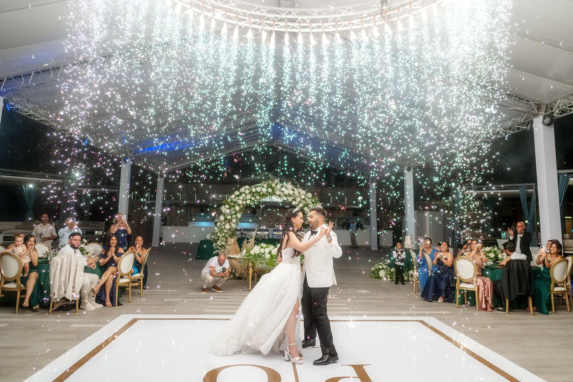 Bride and groom first dance with cold sparklers at Pearl Beach Club wedding reception Bride and groom first dance with cold sparklers at Pearl Beach Club wedding reception