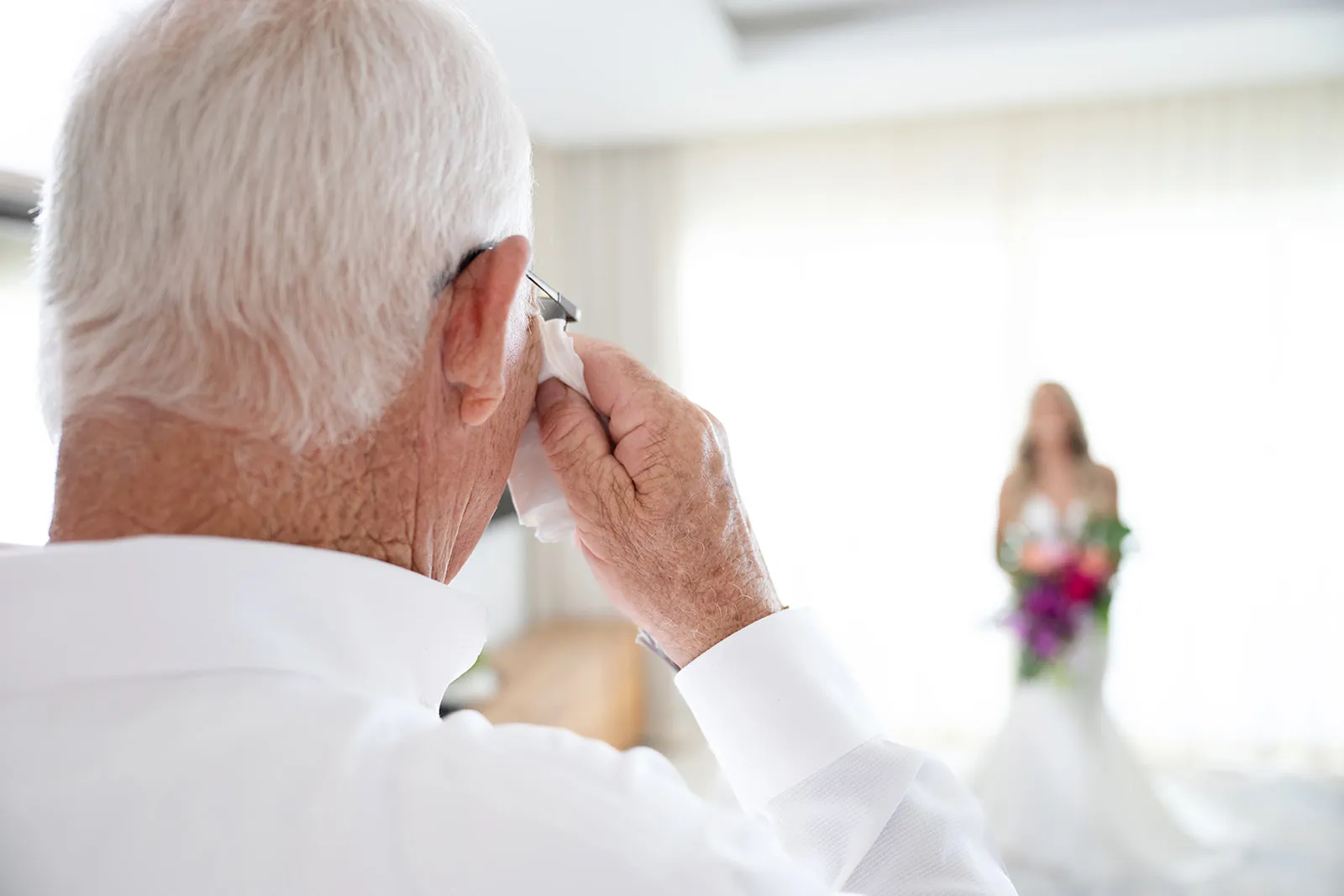 dad and daughter first look jellyfish wedding Father of the bride wiping away tears as he sees his daughter in her wedding dress for the first time