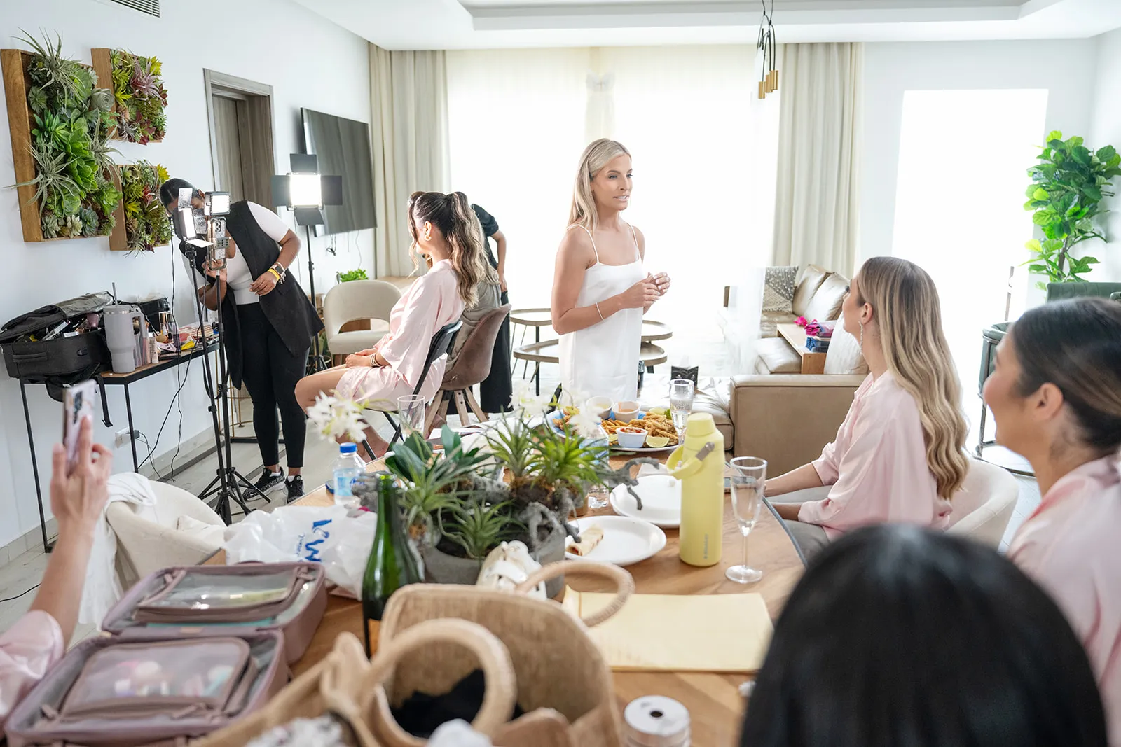 jellyfish restaurant bride getting ready Bride and her bridesmaids in pink robes getting ready on the morning of a Punta Cana wedding